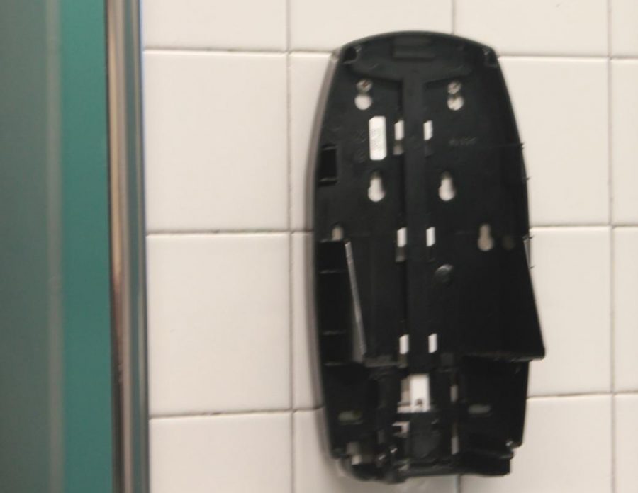 Soap+disperser+damaged+in+boys+bathroom.