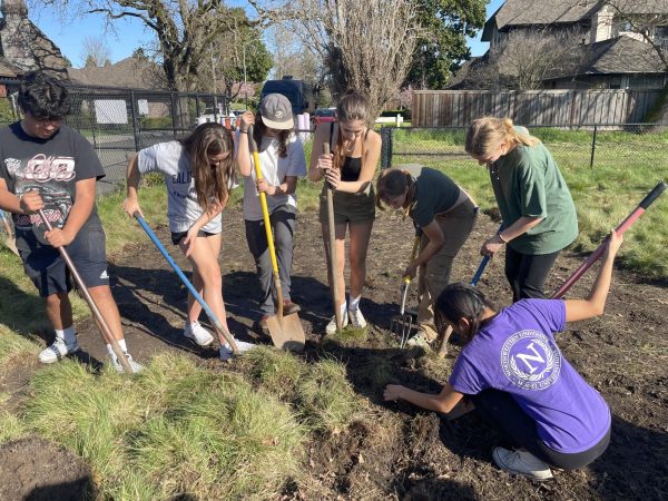 Students preparing the land for native planting (from the left: Alex Garcia, Remy Harrison, Kendall Clemons, Tessa Gude, Siena Kelly, Teagan Rhodes, Thinley Sherpa)