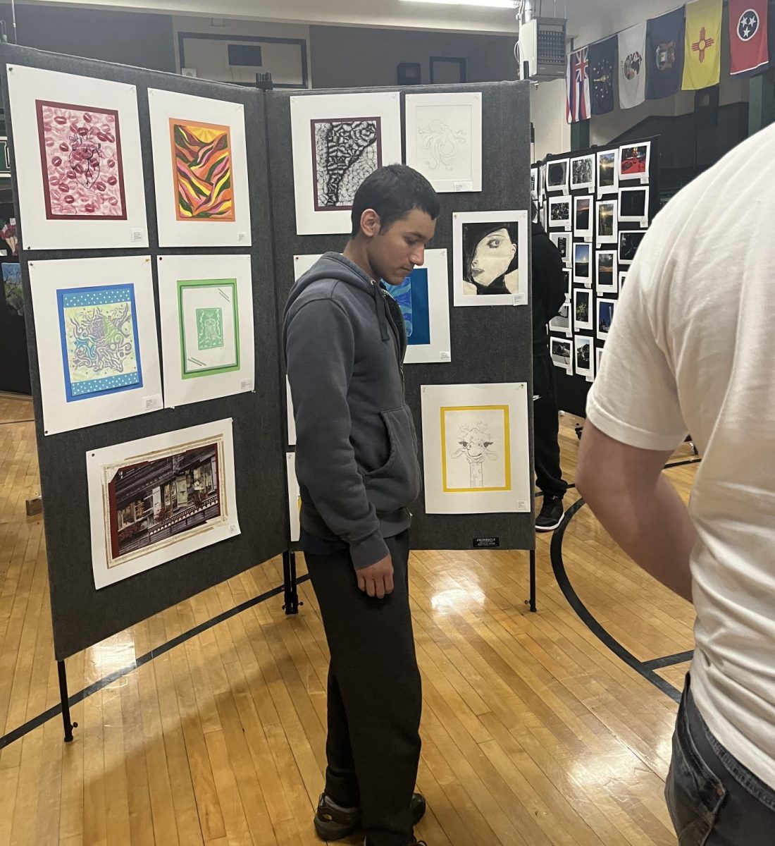 Student looking at Art show