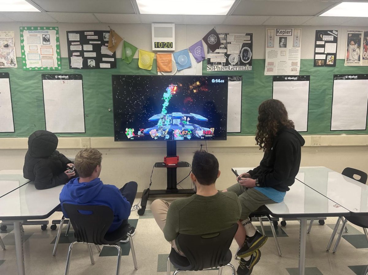 E-sports club/team members face off in a friendly break-time match of Super Smash Bros.